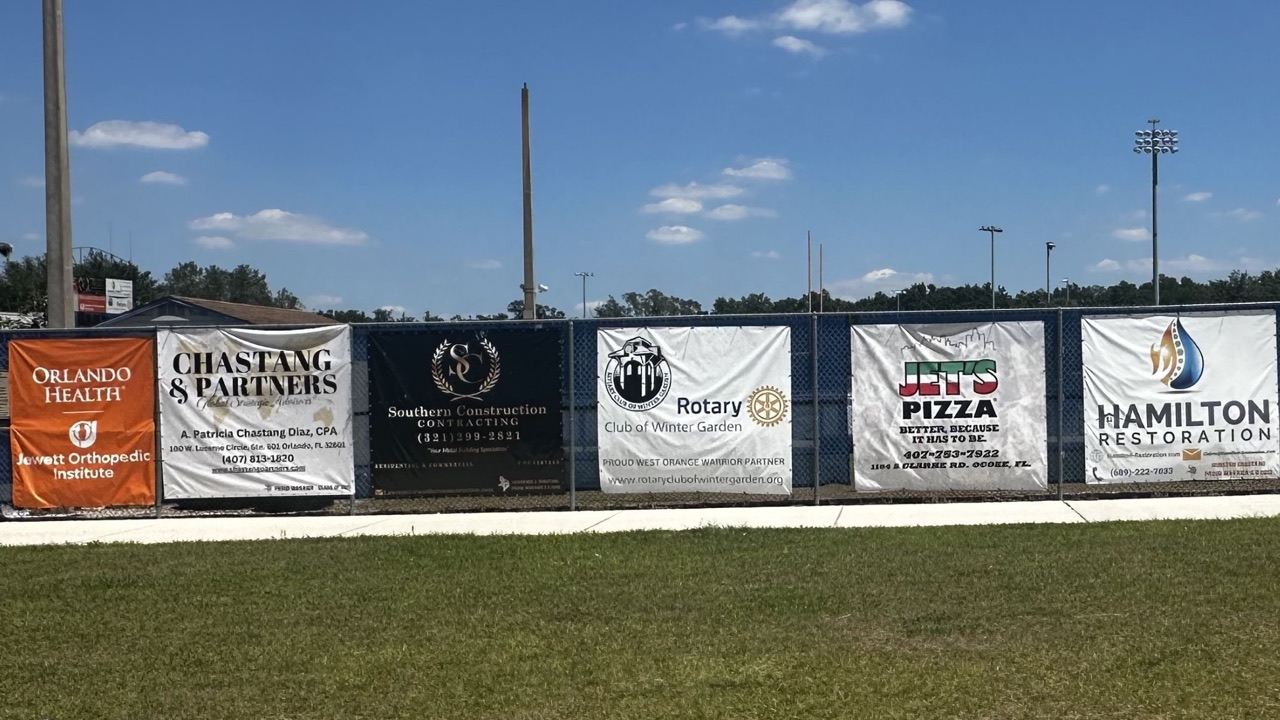 West Orange Warriors sponsor banners along the stadium fence for the Gold Package